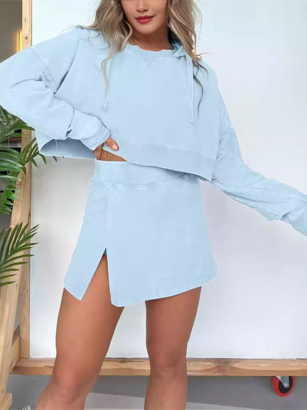 Light blue hoodie and skirt set worn by a person against a white background